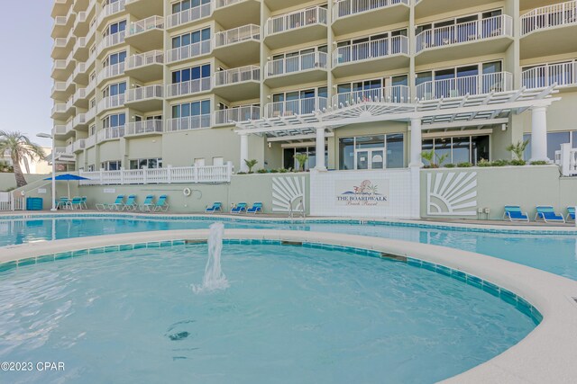 view of pool with pool water feature