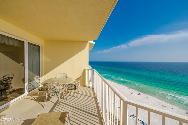 balcony with a view of the beach and a water view