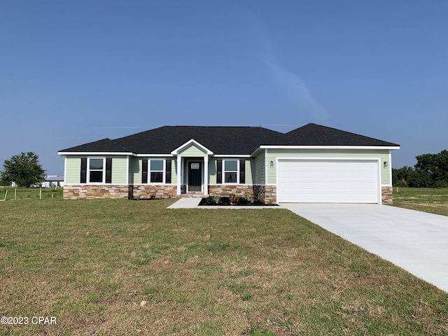 view of front facade with a front lawn and a garage