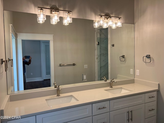 bathroom with vanity and a shower with shower door