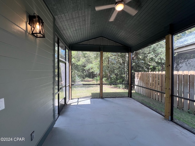 unfurnished sunroom with lofted ceiling and ceiling fan