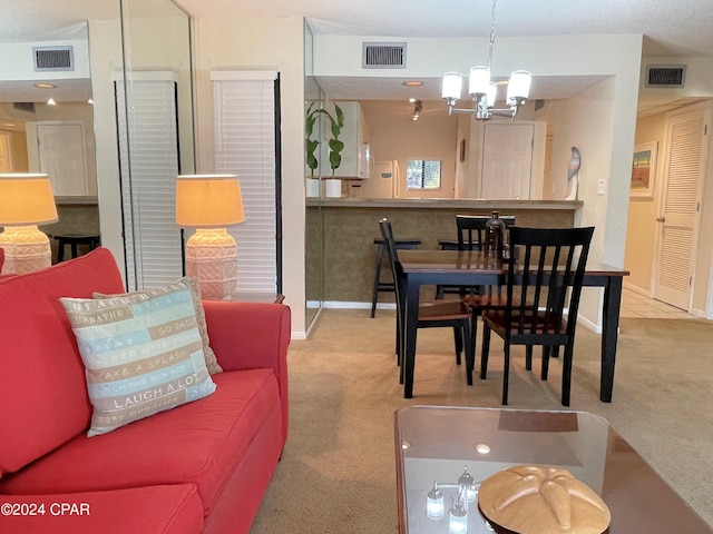 carpeted dining room with a notable chandelier