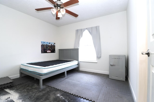 unfurnished bedroom featuring ceiling fan