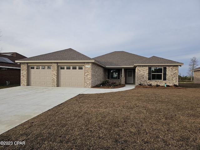 prairie-style home featuring a garage