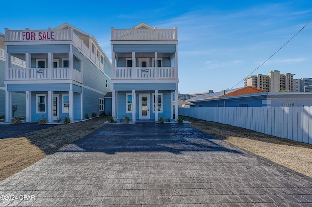 view of front of house with a balcony