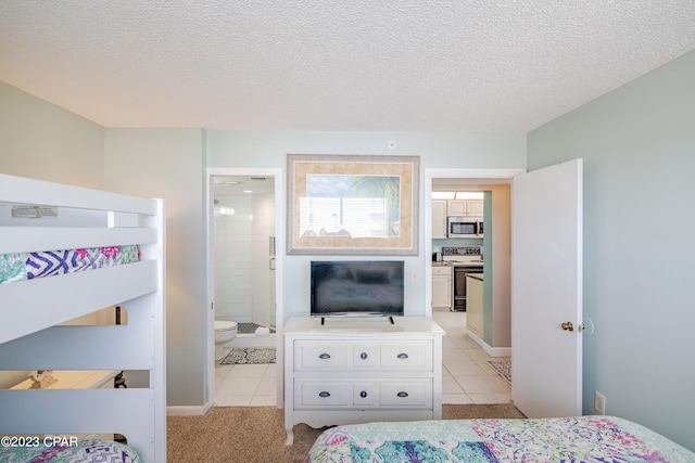 bedroom featuring light colored carpet, connected bathroom, and a textured ceiling