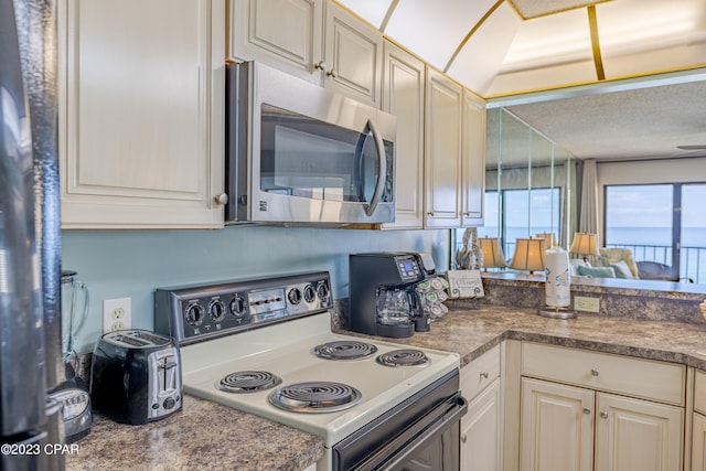 kitchen with a water view and stainless steel appliances