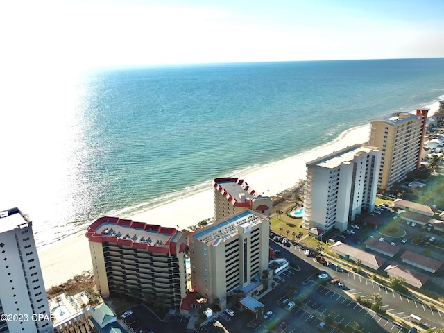 birds eye view of property featuring a water view and a view of the beach