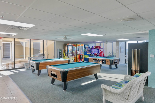 recreation room with pool table, ceiling fan, a drop ceiling, and light tile flooring