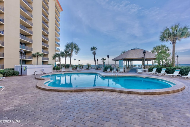 view of pool featuring a gazebo and a patio area