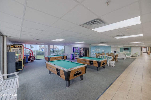 recreation room with a paneled ceiling, billiards, and tile flooring