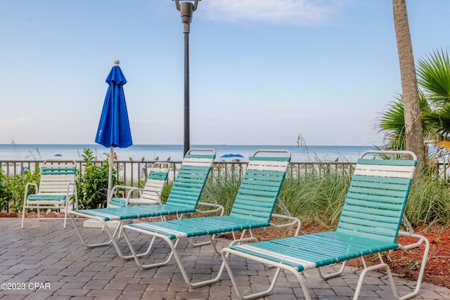 view of terrace with a water view