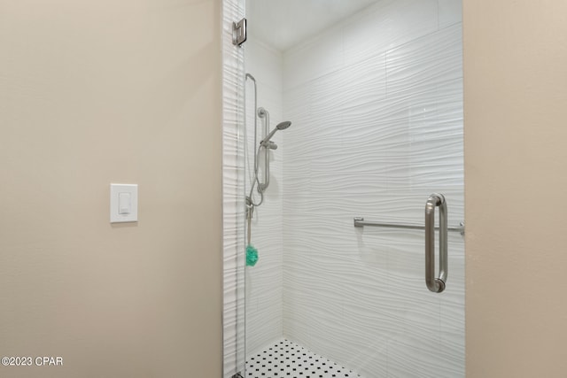 bathroom with tiled shower