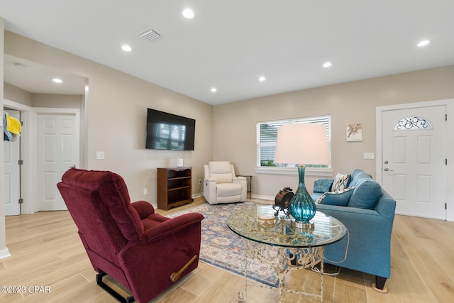 living room with light hardwood / wood-style floors