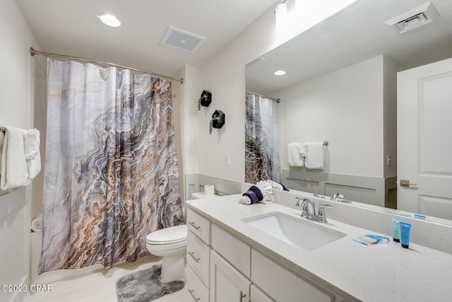 bathroom with vanity, toilet, curtained shower, and tile patterned flooring