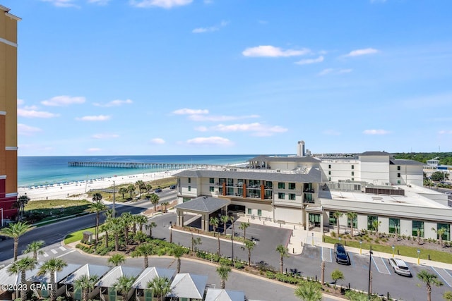 exterior space with a water view and a beach view