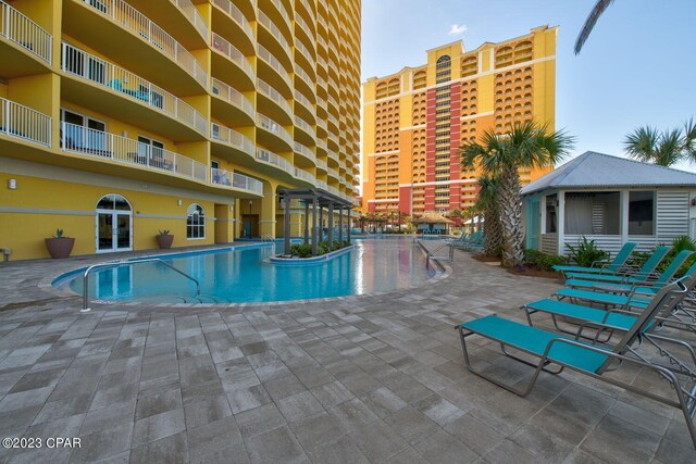 view of swimming pool with a patio area