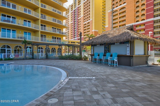 exterior space featuring a water view and a beach view