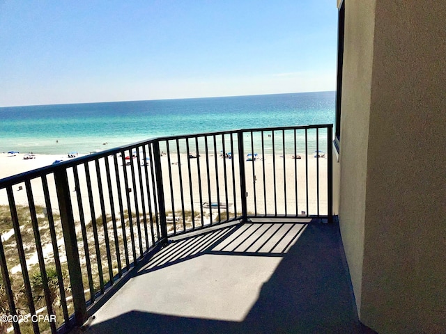 balcony with a view of the beach and a water view