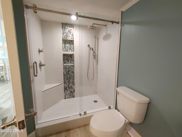 full bath with a stall shower and toilet