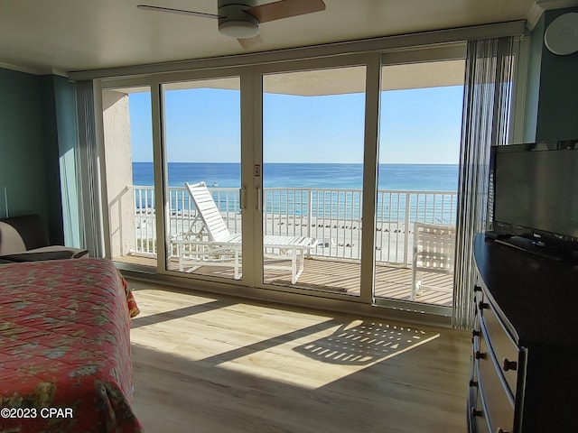 bedroom featuring wood finished floors and access to exterior