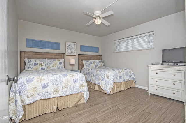 bedroom with light hardwood / wood-style floors and ceiling fan