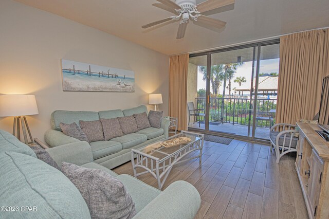 bedroom featuring wood-type flooring, ceiling fan, access to exterior, and a textured ceiling