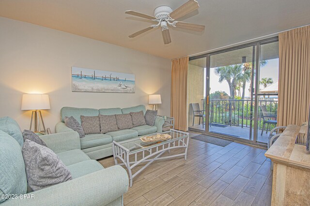 bedroom with ensuite bath, a closet, and ceiling fan