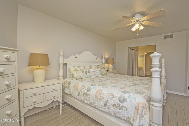 bedroom with ensuite bath, a closet, and ceiling fan