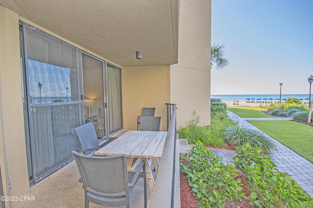 balcony featuring a water view