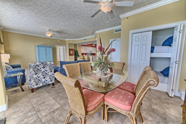 dining space featuring crown molding, a textured ceiling, and ceiling fan