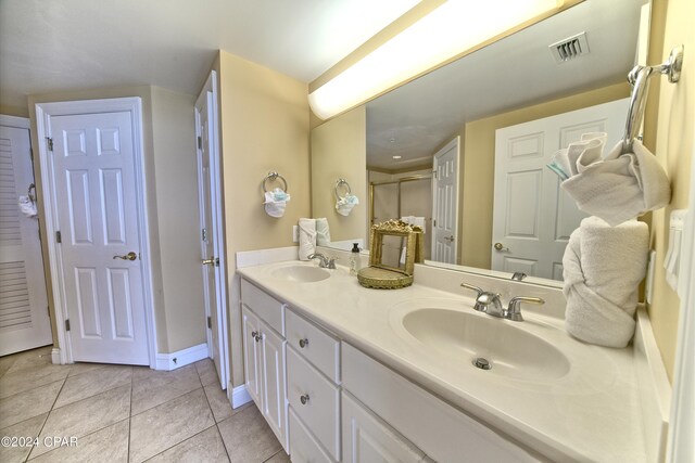 bathroom featuring tile patterned flooring and vanity