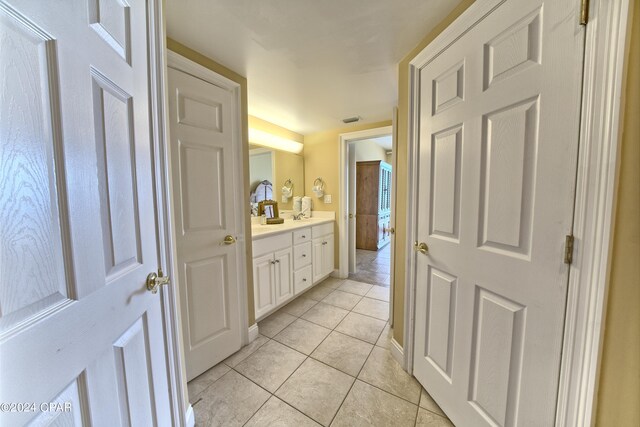 bathroom with vanity and tile patterned floors