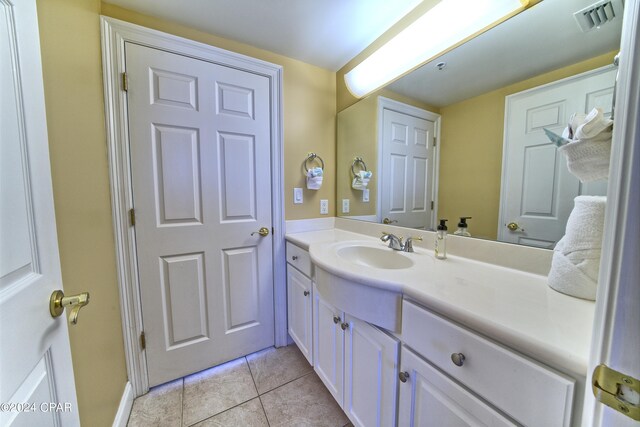 bathroom featuring vanity and tile patterned flooring