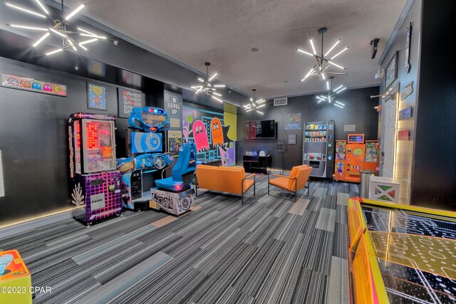 game room featuring an inviting chandelier, carpet floors, and a textured ceiling