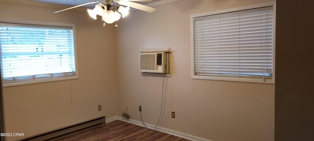 unfurnished room with ceiling fan, dark wood-type flooring, a baseboard heating unit, a wall mounted AC, and ornamental molding