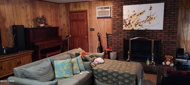 living room featuring brick wall, wood walls, a brick fireplace, and a wall unit AC