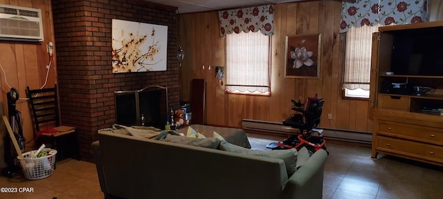 tiled living room featuring brick wall, a baseboard heating unit, a wall unit AC, a brick fireplace, and wooden walls