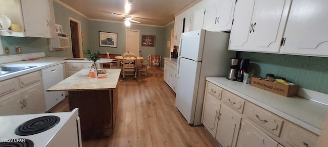 kitchen with a center island, ceiling fan, light hardwood / wood-style flooring, white appliances, and white cabinets