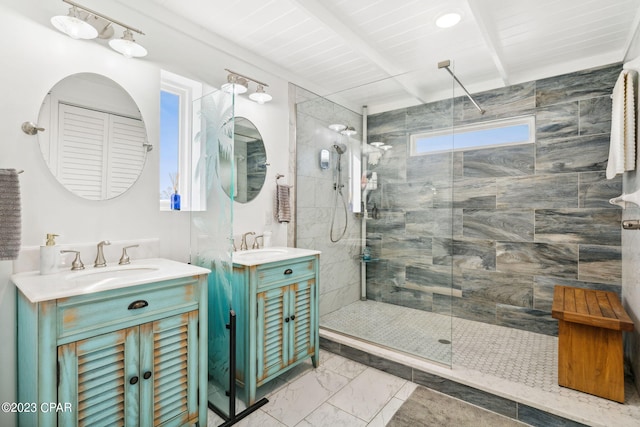 bathroom with double vanity, a shower with door, beamed ceiling, wooden ceiling, and tile floors