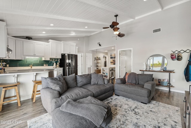 living room with high vaulted ceiling, light hardwood / wood-style floors, ceiling fan, and wooden ceiling