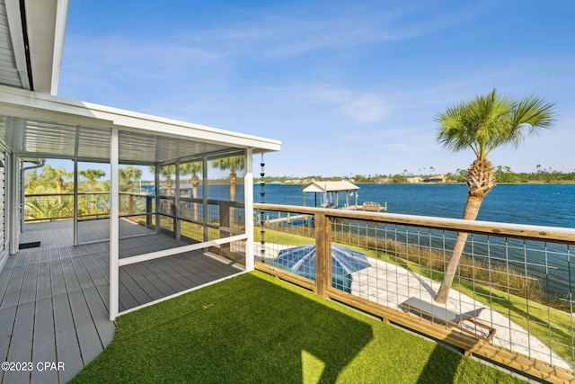 exterior space with a water view and a yard