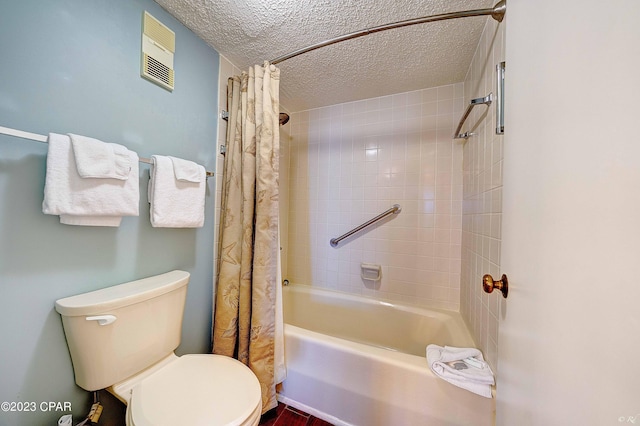 bathroom featuring shower / bath combo, a textured ceiling, and toilet