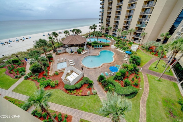 aerial view featuring a beach view and a water view