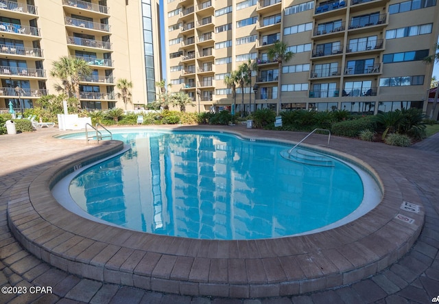 view of pool featuring a patio