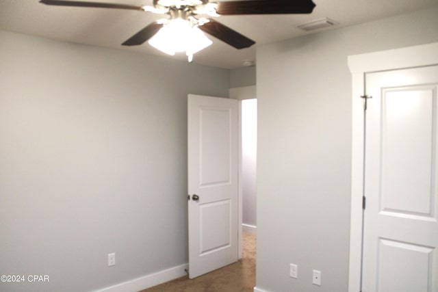 unfurnished bedroom featuring ceiling fan