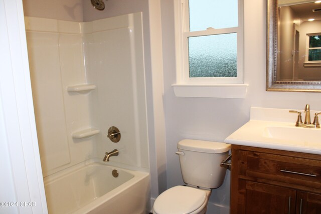 full bathroom with vanity, shower / bathtub combination, and toilet