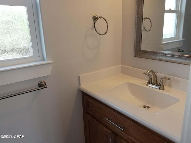 bathroom featuring vanity and a wealth of natural light