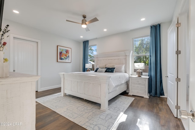 bedroom with ceiling fan and dark wood-type flooring