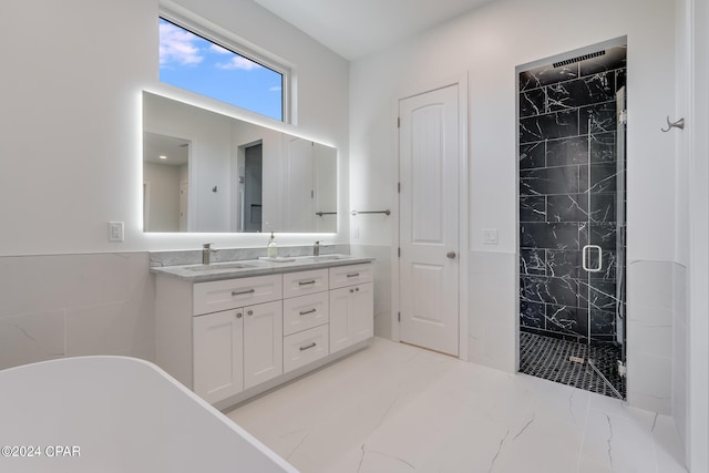 bathroom with dual bowl vanity, an enclosed shower, and tile floors